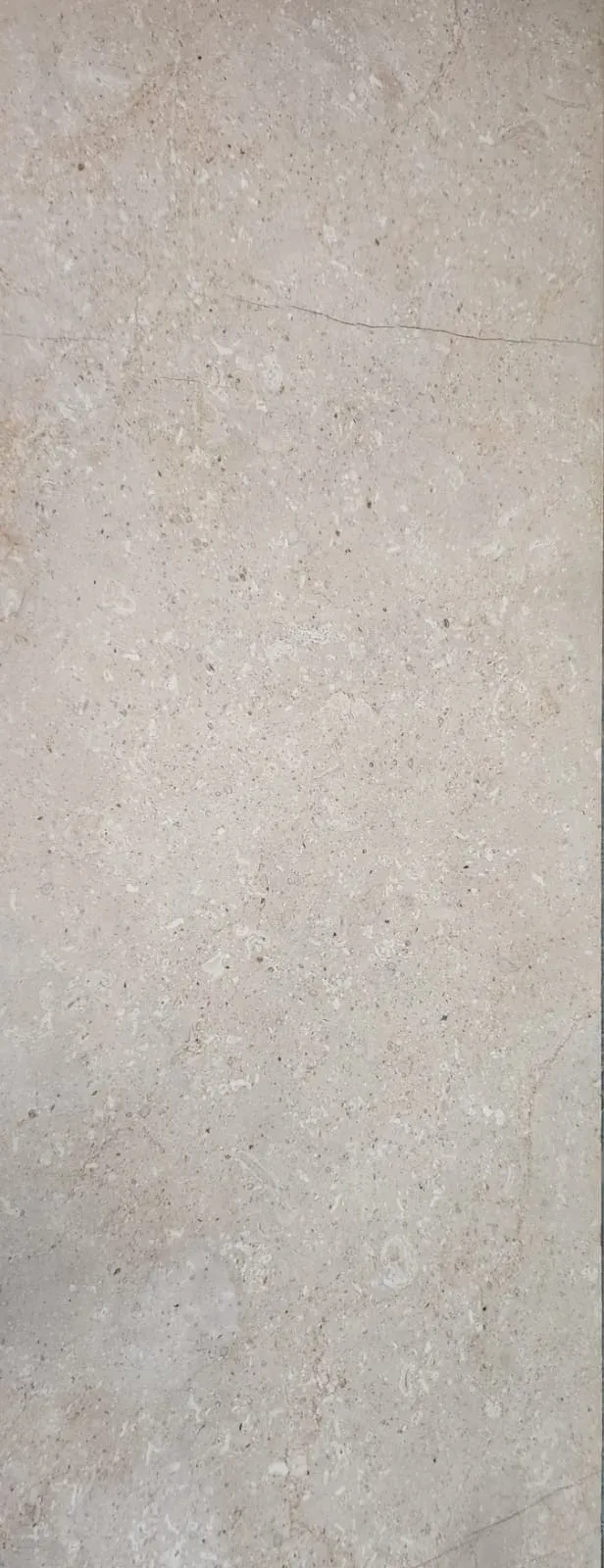 Polished slab of Tipi marble in gold tones