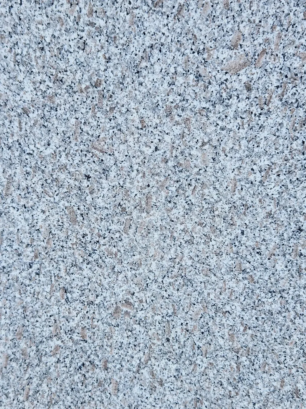 Polished slab of Sado Pink granite