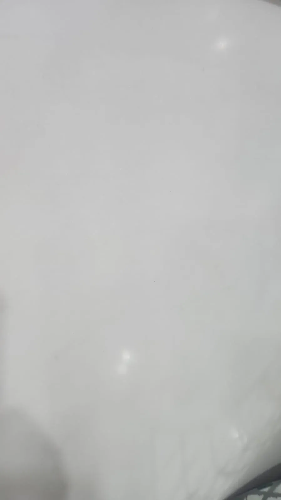 Polished slab of Snow White granite